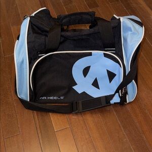“UNC “Logo Athletic Black and Light Blue UNC Duffel Bag